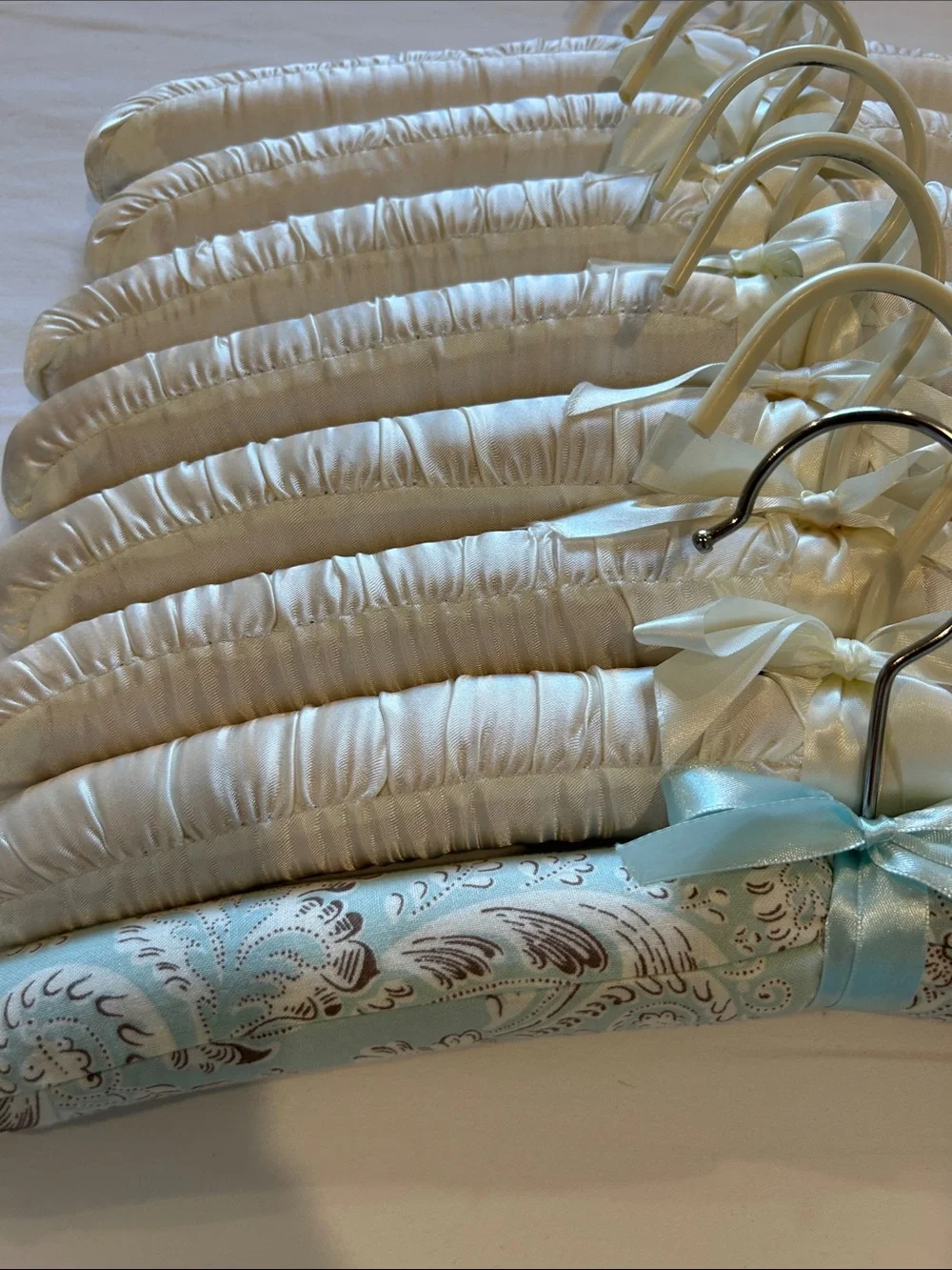 Set of 8 Cream Satin Padded Hangers with one Blue Paisley one